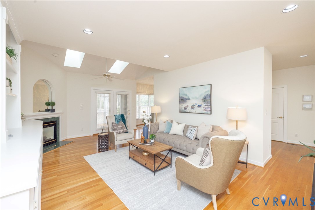 5713 Promontory Place Midlothian, VA 23112 - Photo 8 of 39 a living room with furniture and a fireplace
