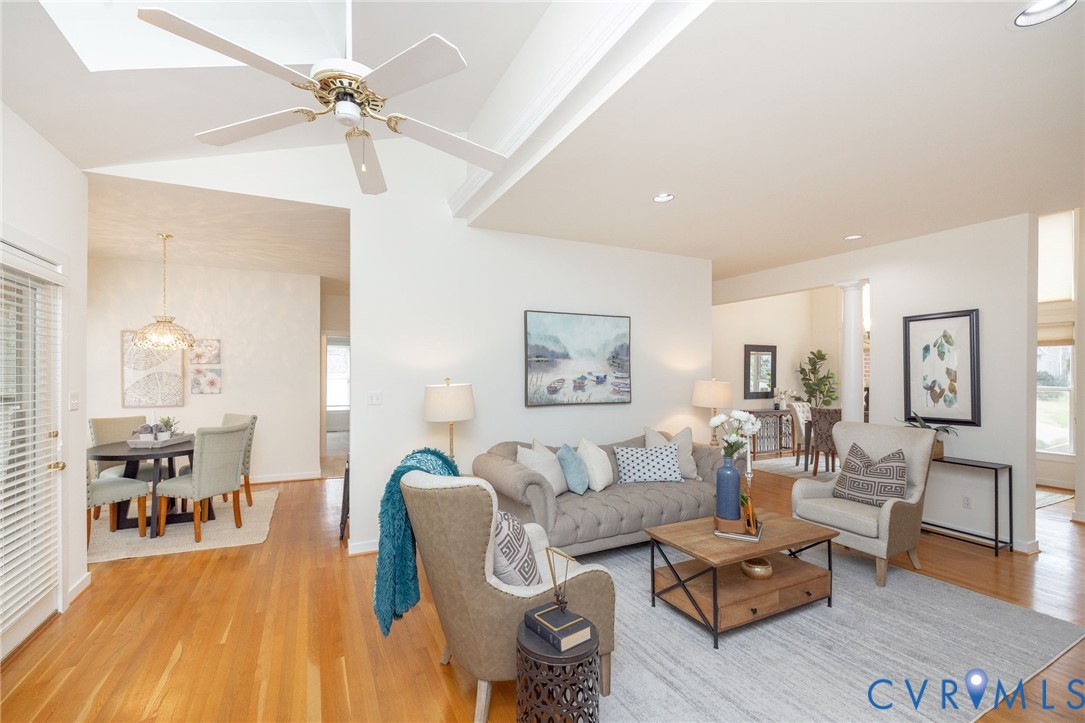 5713 Promontory Place Midlothian, VA 23112 - Photo 10 of 39 a living room with furniture and wooden floor