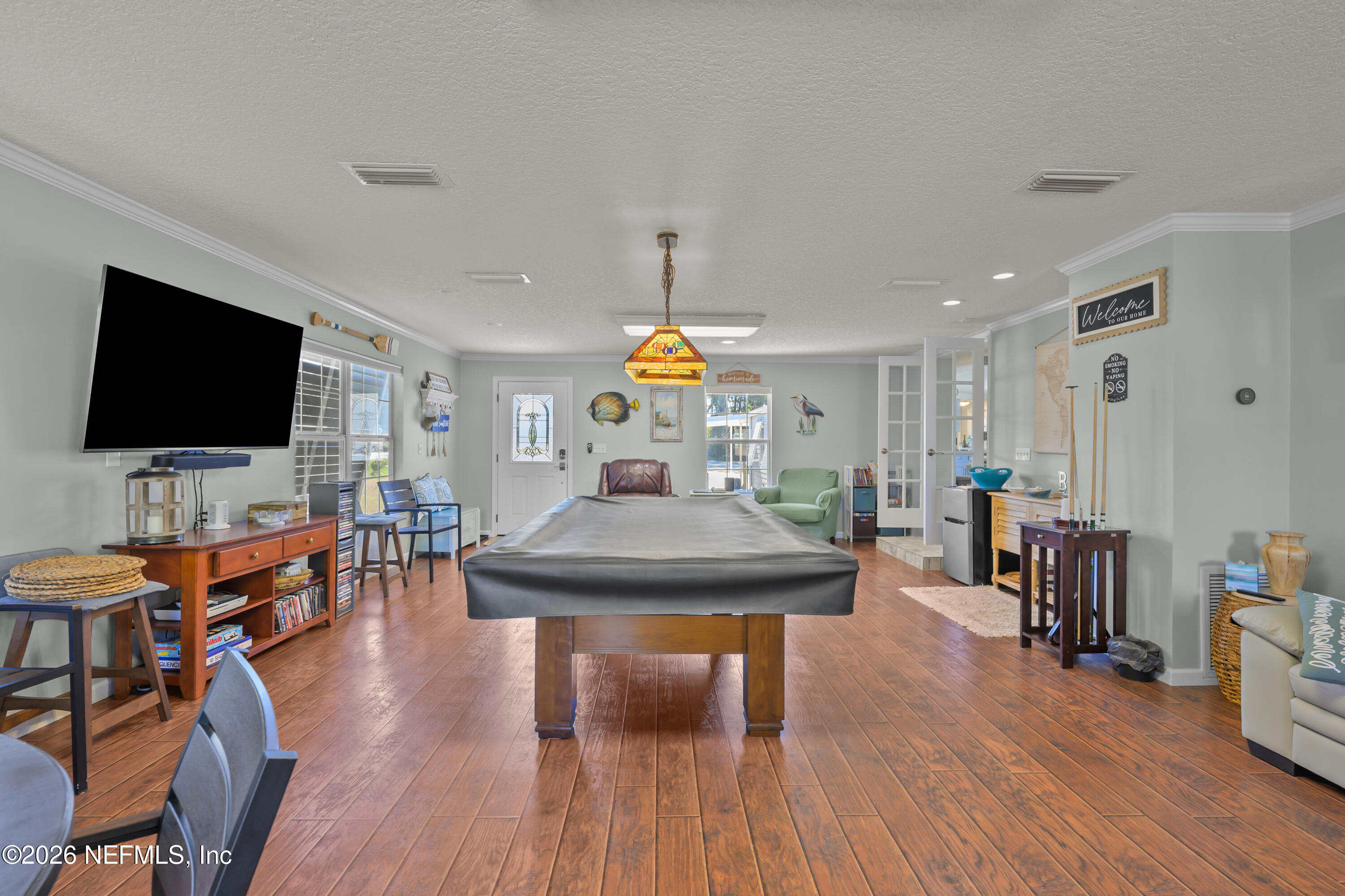 253 Hess Road Crescent City, FL 32112 - Photo 12 of 38 a view of a livingroom with furniture and a flat screen tv