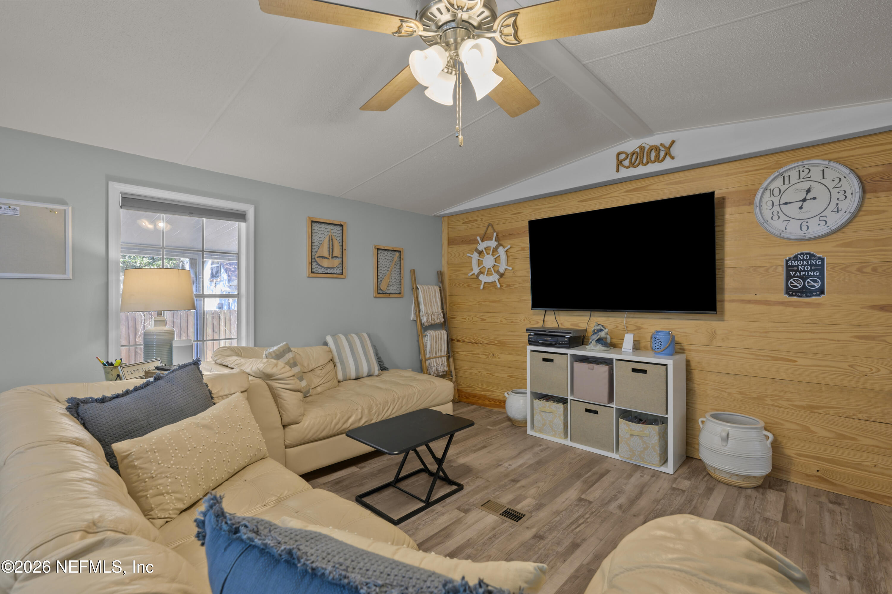 253 Hess Road Crescent City, FL 32112 - Photo 14 of 38 a living room with furniture and a flat screen tv
