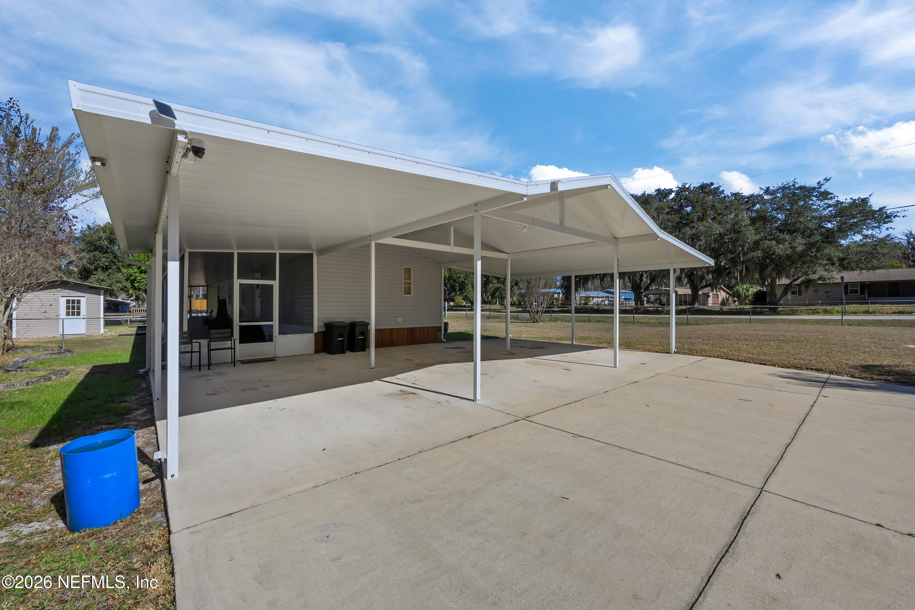 253 Hess Road Crescent City, FL 32112 - Photo 21 of 38 a view of a chairs and table in the patio