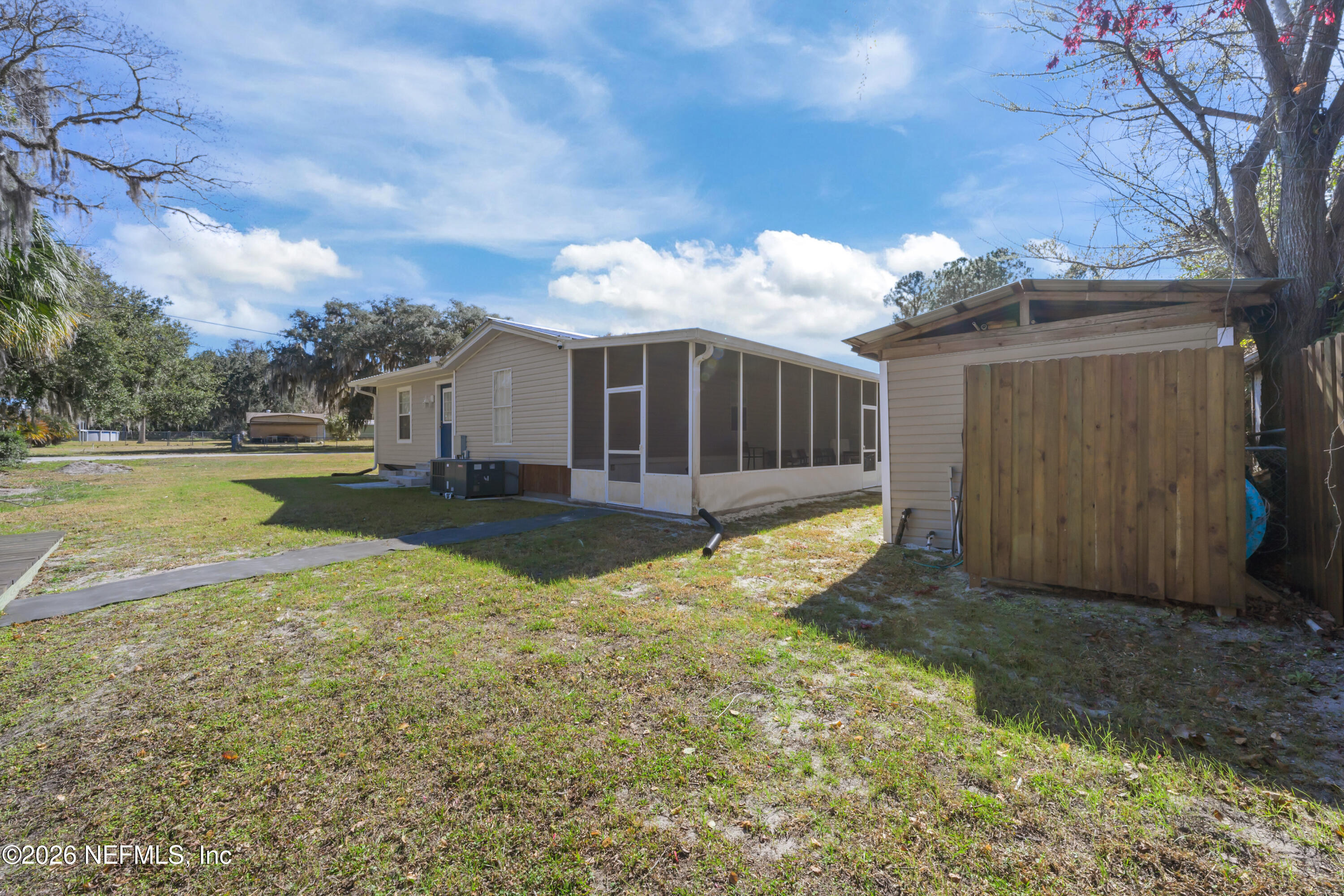 253 Hess Road Crescent City, FL 32112 - Photo 22 of 38 a view of a yard with wooden fence