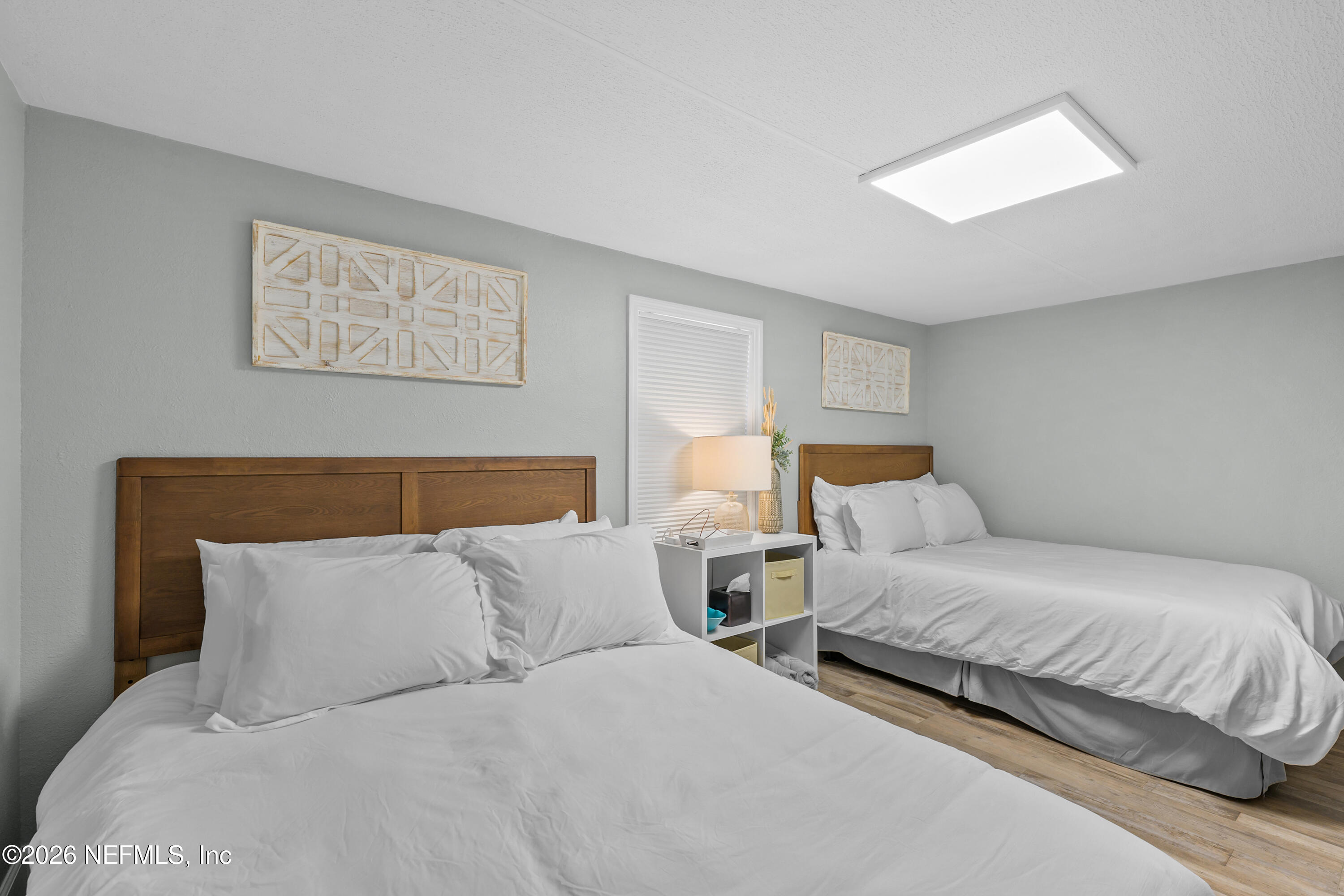 253 Hess Road Crescent City, FL 32112 - Photo 23 of 38 a bedroom with two beds and painting on the wall