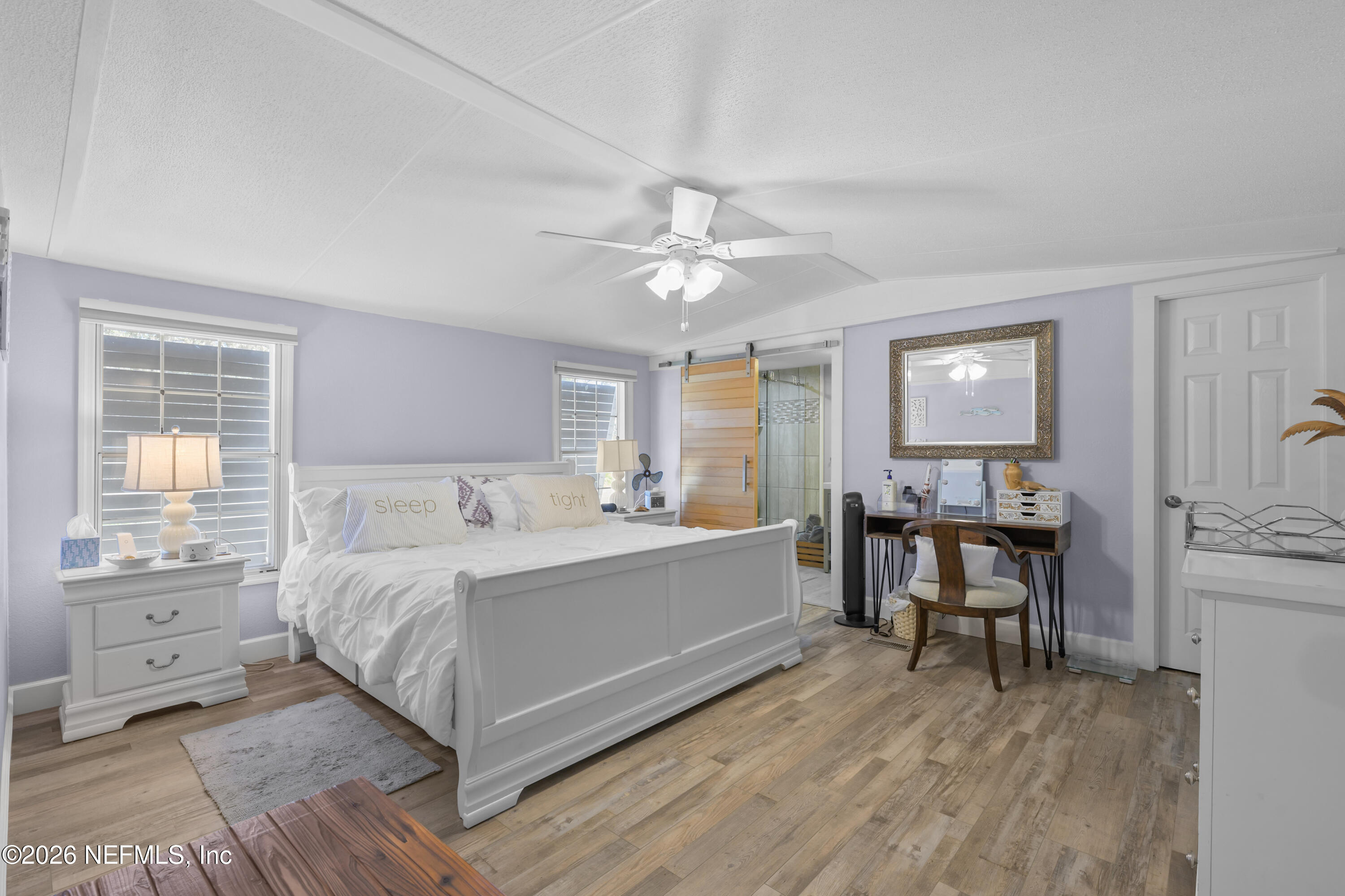 253 Hess Road Crescent City, FL 32112 - Photo 25 of 38 a spacious bedroom with a bed and a table in it