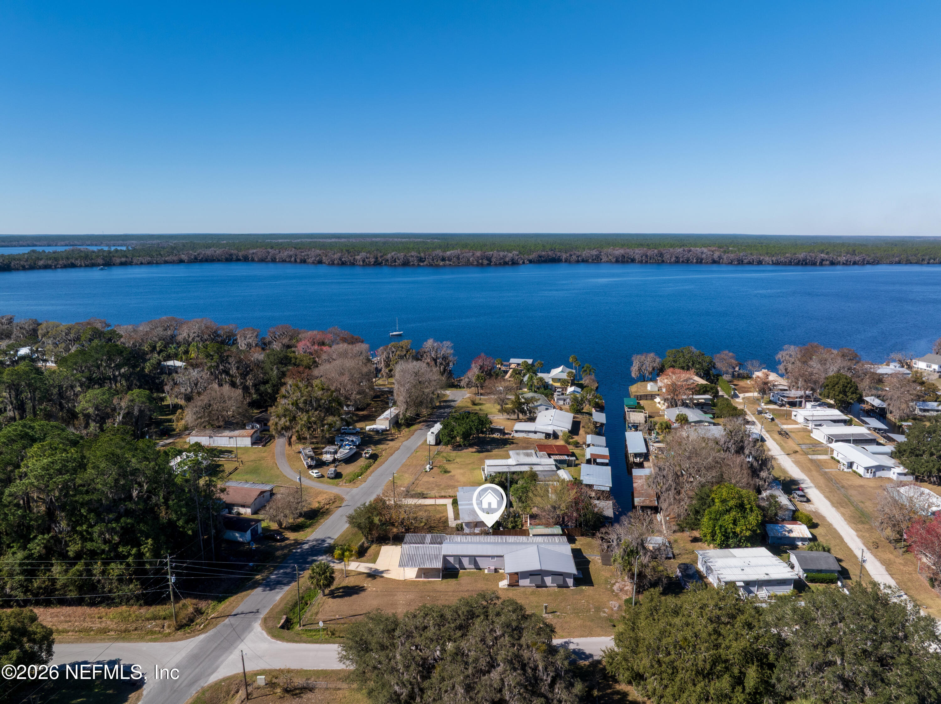 253 Hess Road Crescent City, FL 32112 - Photo 30 of 38 an aerial view of a house with a lake view