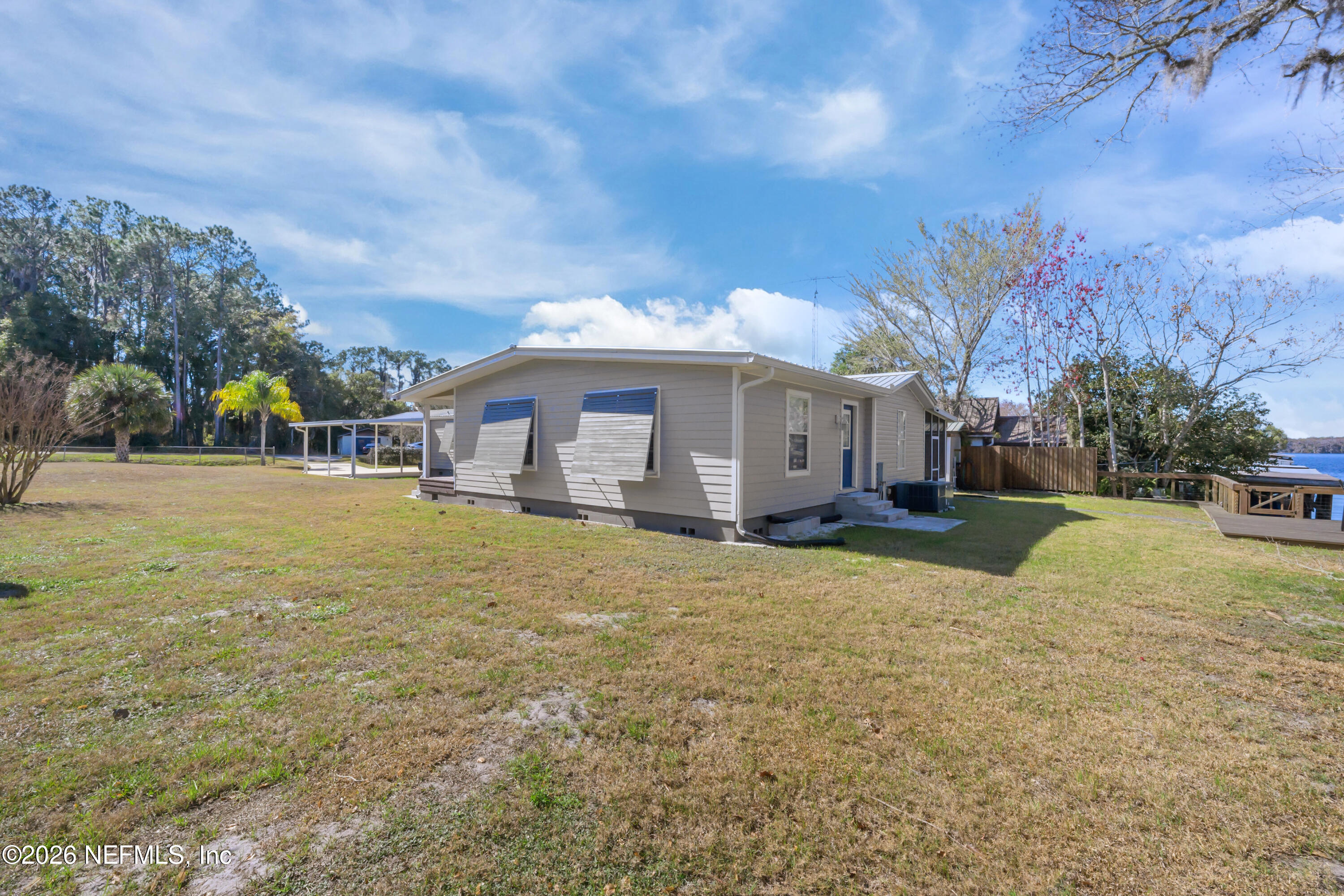 253 Hess Road Crescent City, FL 32112 - Photo 7 of 38 a view of a house with backyard and tree