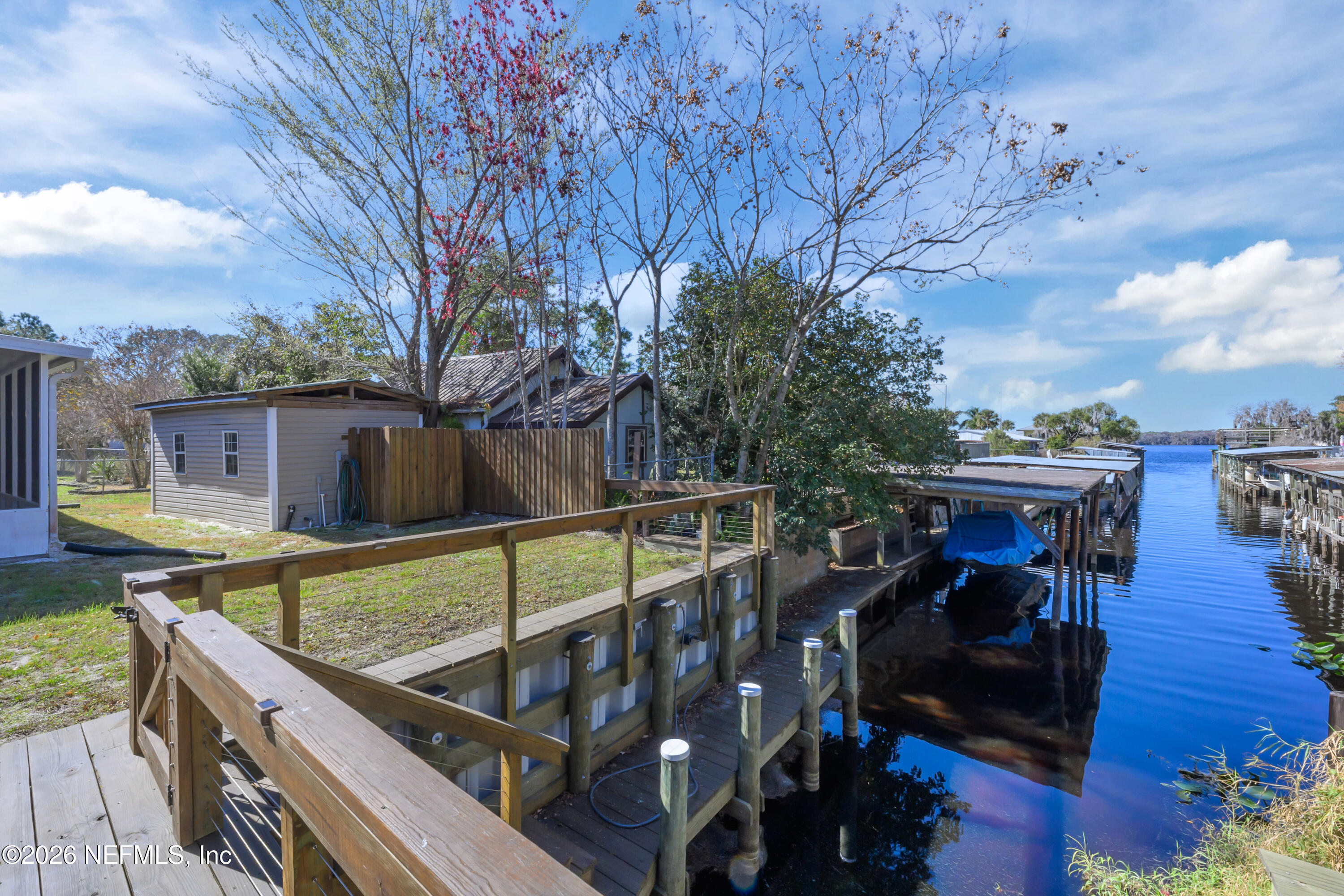 253 Hess Road Crescent City, FL 32112 - Photo 9 of 38 a view of a balcony with two chairs and a table