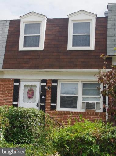 2907 Rayshire Road Baltimore, MD 21230 - Photo 1 of 7 a front view of a house with a yard and garage