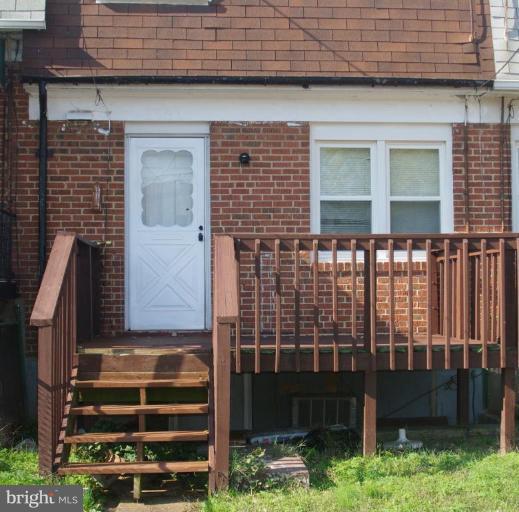 2907 Rayshire Road Baltimore, MD 21230 - Photo 7 of 7 a front view of a house with a garden
