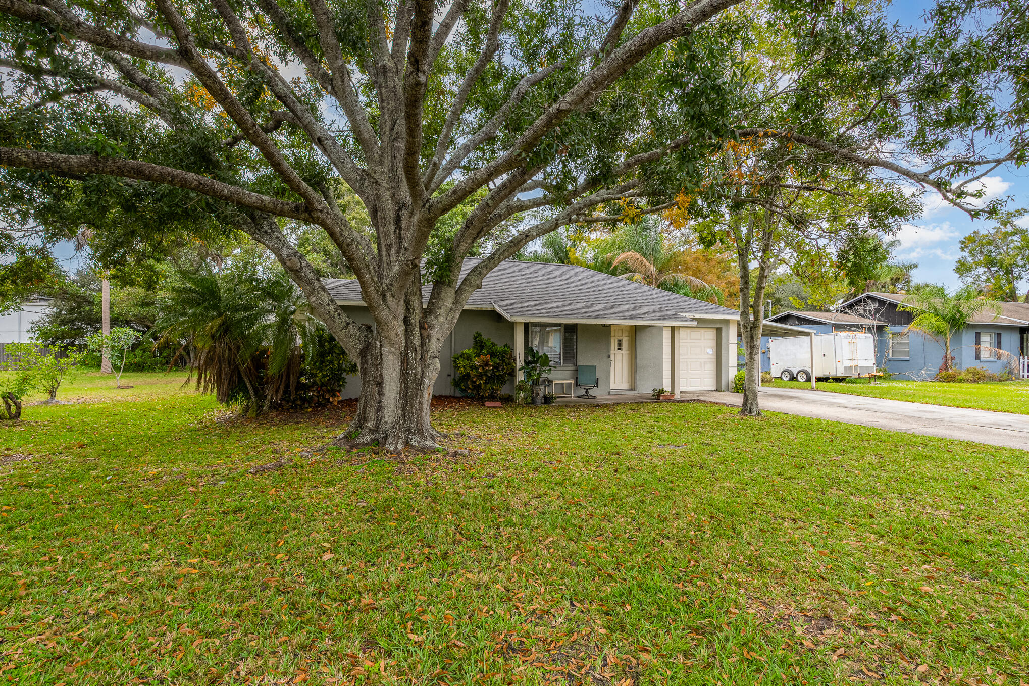 1908 Glendon Drive Melbourne, FL 32901 - Photo 11 of 26 a front view of a house with yard and green space