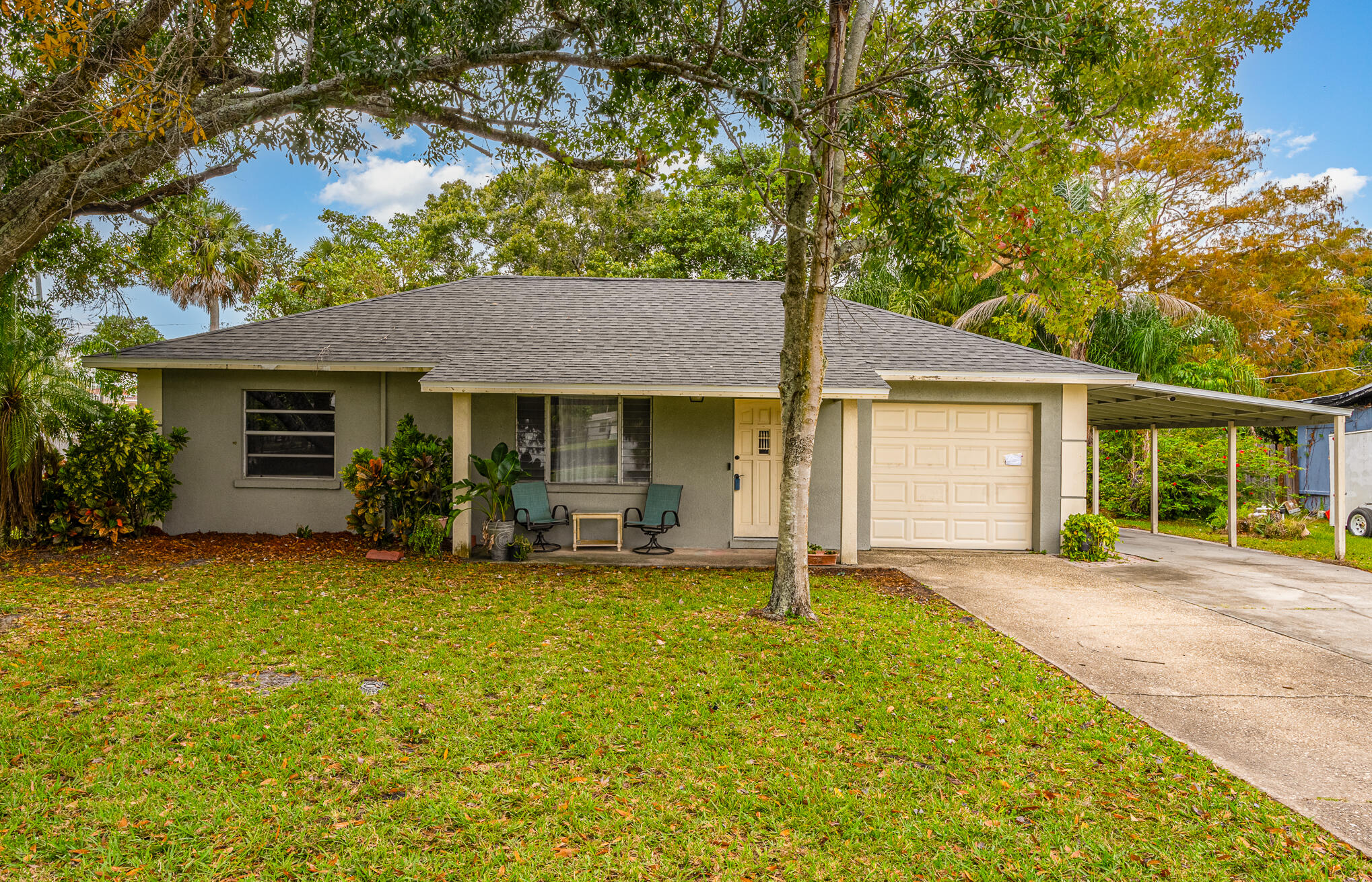 1908 Glendon Drive Melbourne, FL 32901 - Photo 12 of 26 a front view of a house with a garden and yard