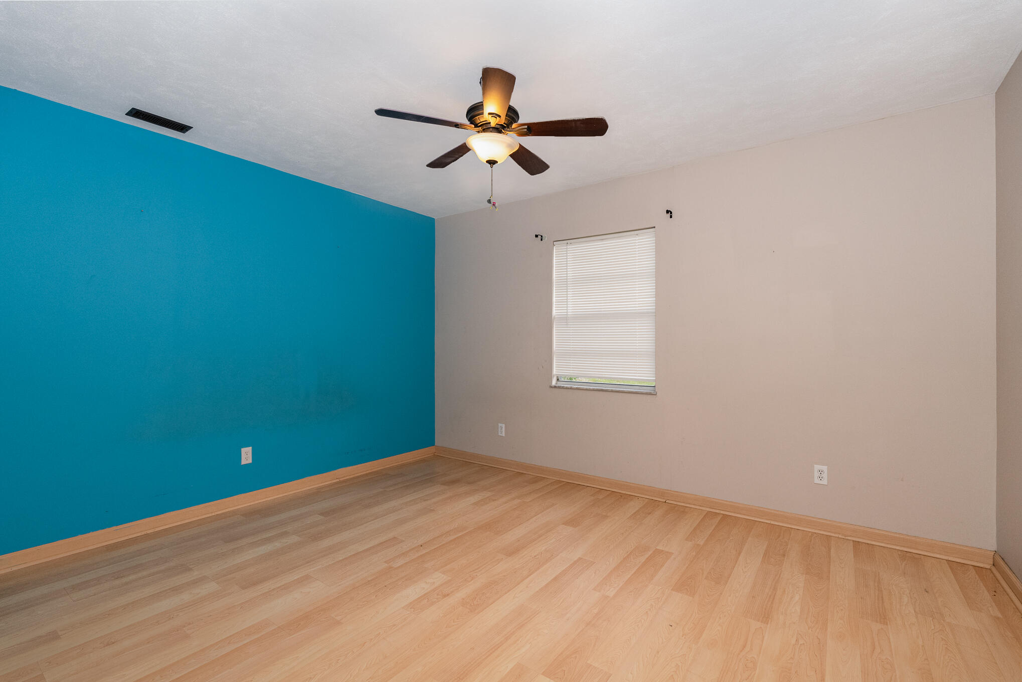 1908 Glendon Drive Melbourne, FL 32901 - Photo 16 of 26 wooden floor in an empty room with a window