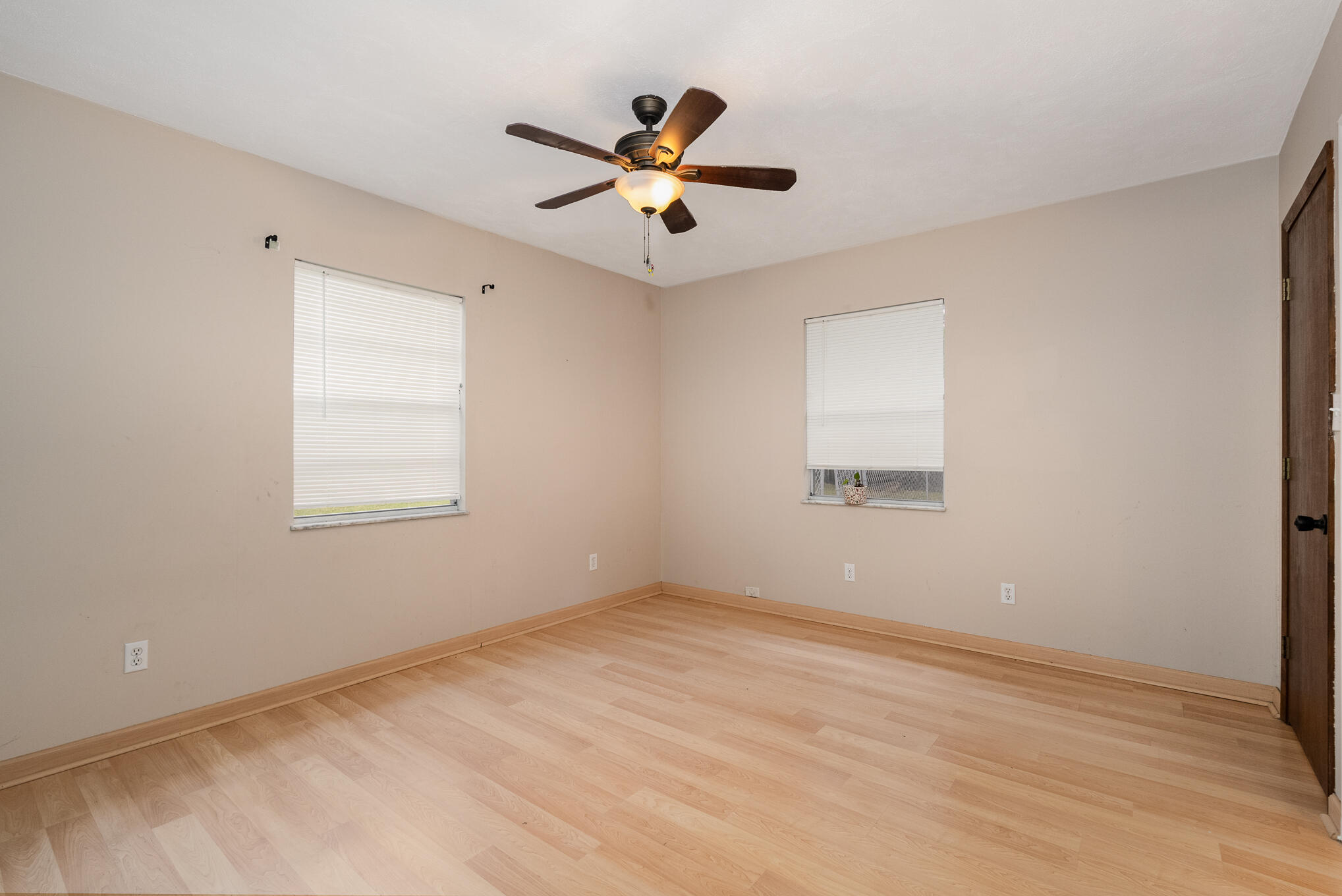 1908 Glendon Drive Melbourne, FL 32901 - Photo 19 of 26 an empty room with ceiling fan and window