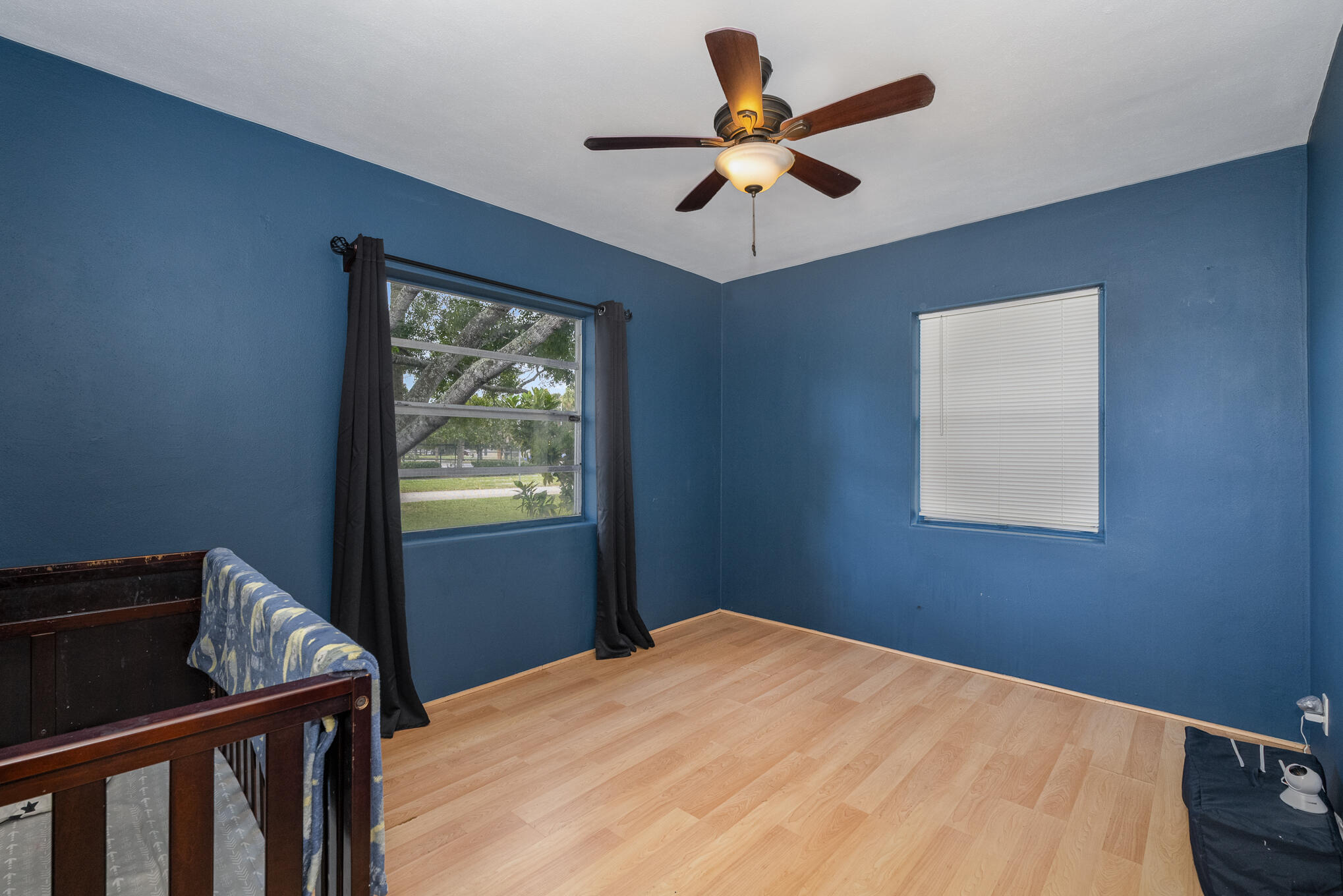 1908 Glendon Drive Melbourne, FL 32901 - Photo 20 of 26 a bedroom with a bed and a window