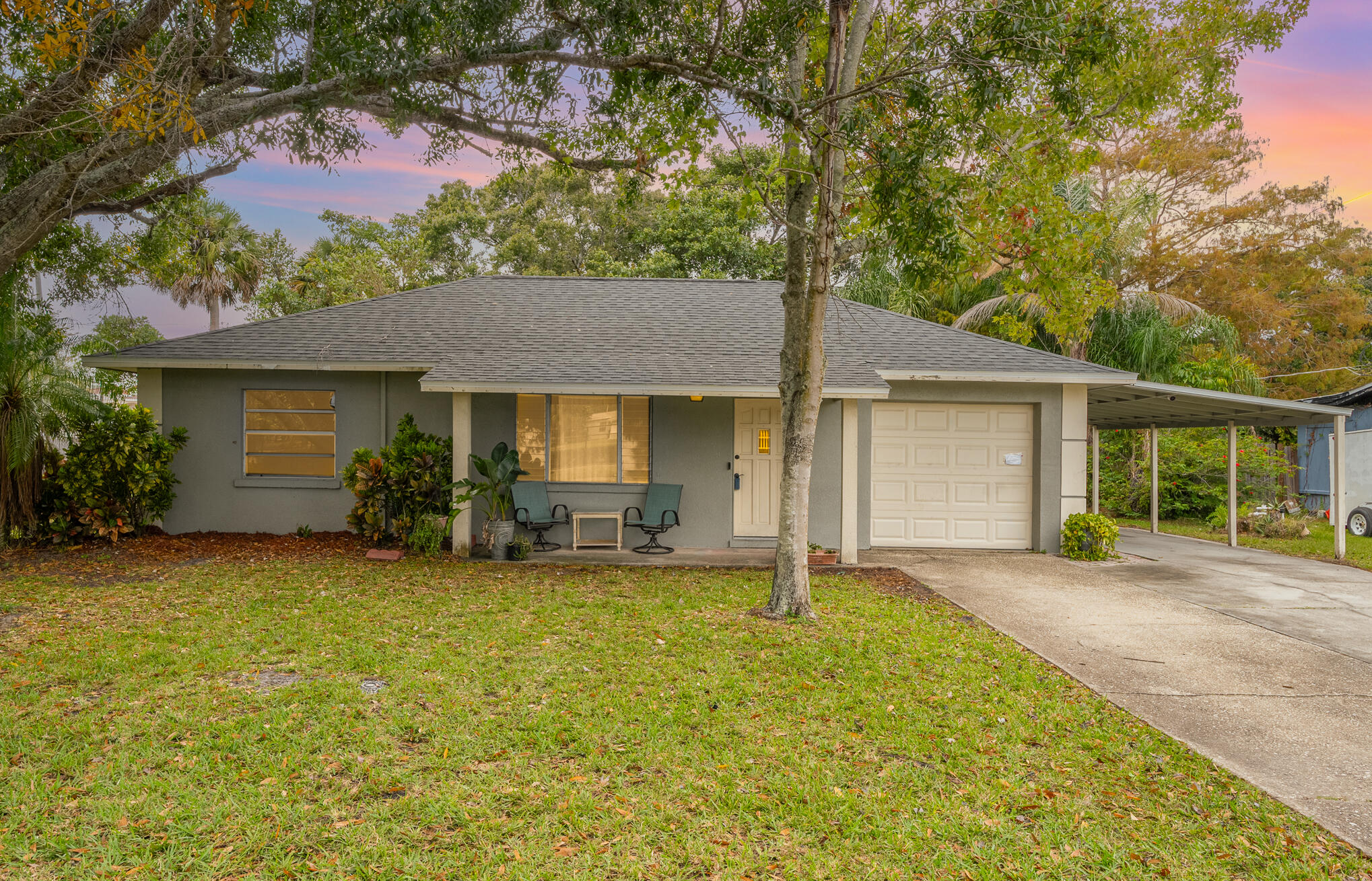1908 Glendon Drive Melbourne, FL 32901 - Photo 9 of 26 front view of a house with a yard and potted plants