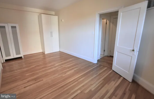 a view of a room with wooden floor and staircase