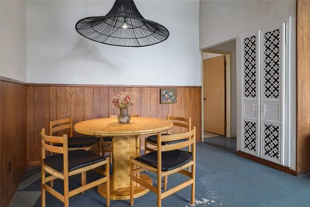 a kitchen with stainless steel appliances a refrigerator sink and white cabinets