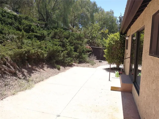 a view of a pathway with a yard