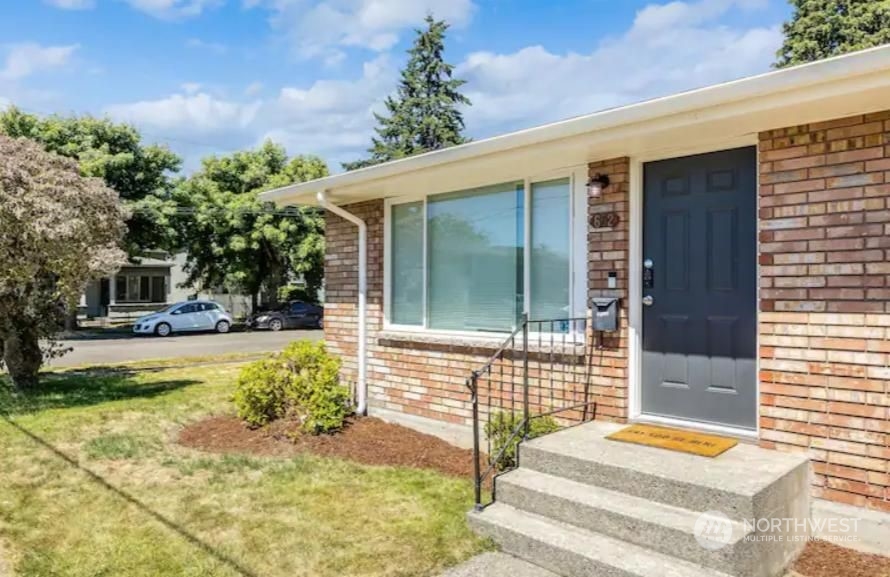 602 South 5th Street Renton, WA 98057 - Photo 2 of 27 a view of house with backyard and swimming pool
