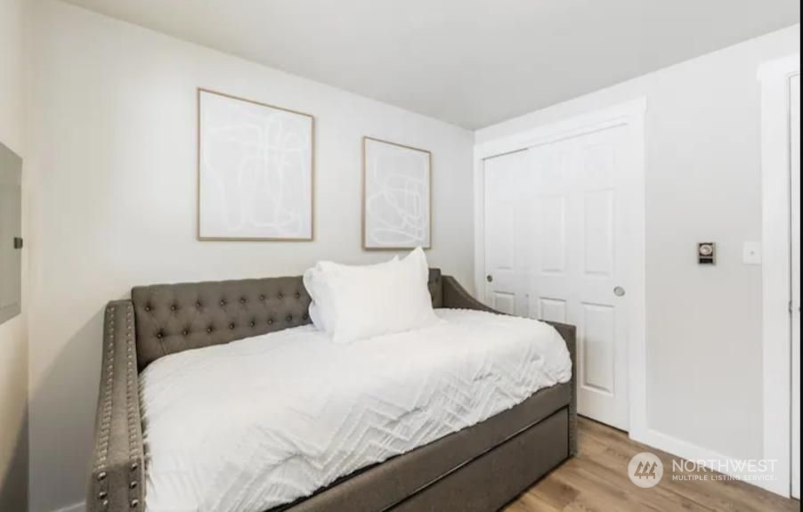 602 South 5th Street Renton, WA 98057 - Photo 6 of 27 a bedroom with a bed and a window