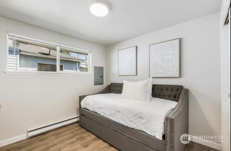 602 South 5th Street Renton, WA 98057 - Photo 8 of 27 a bedroom with a bed and a window