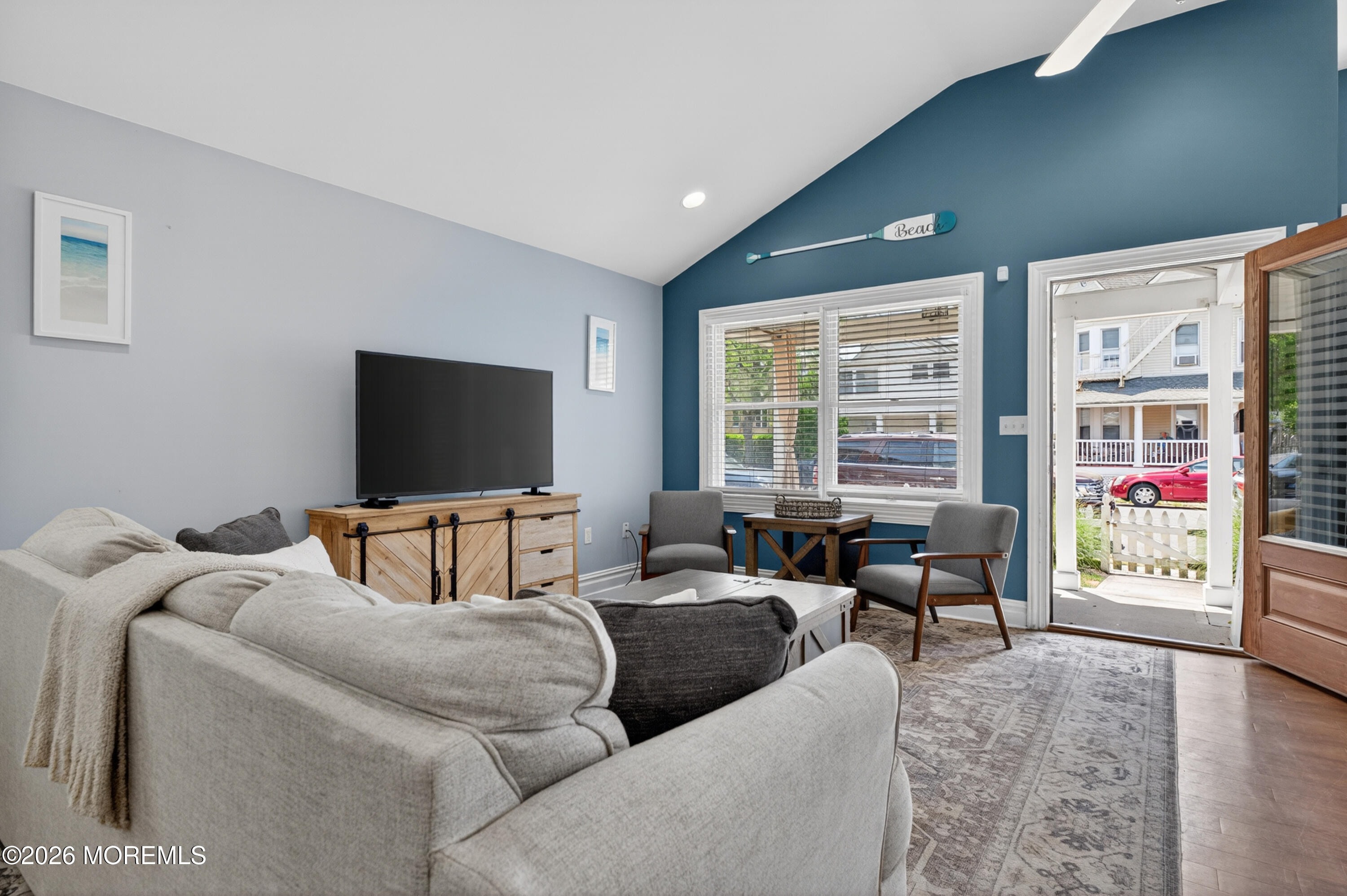 65 Heck Avenue Ocean Grove, NJ 07756 - Photo 14 of 37 a living room with furniture and a flat screen tv