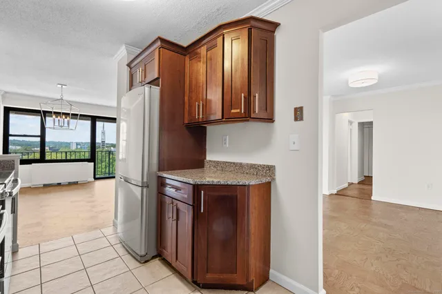 a kitchen with a refrigerator and a sink