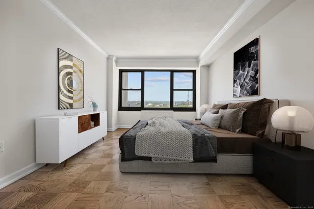 a bedroom with bed and window