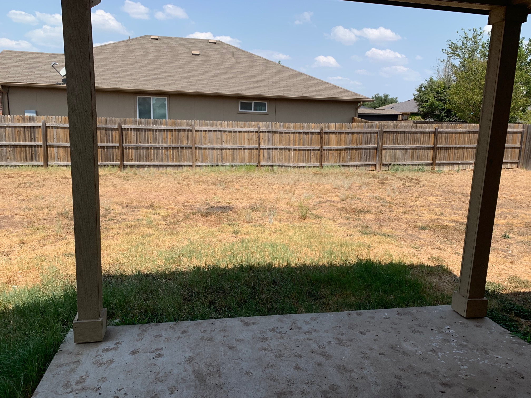 384 Discovery Kyle, TX 78640 - Photo 18 of 18 Fenced backyard with a patio area