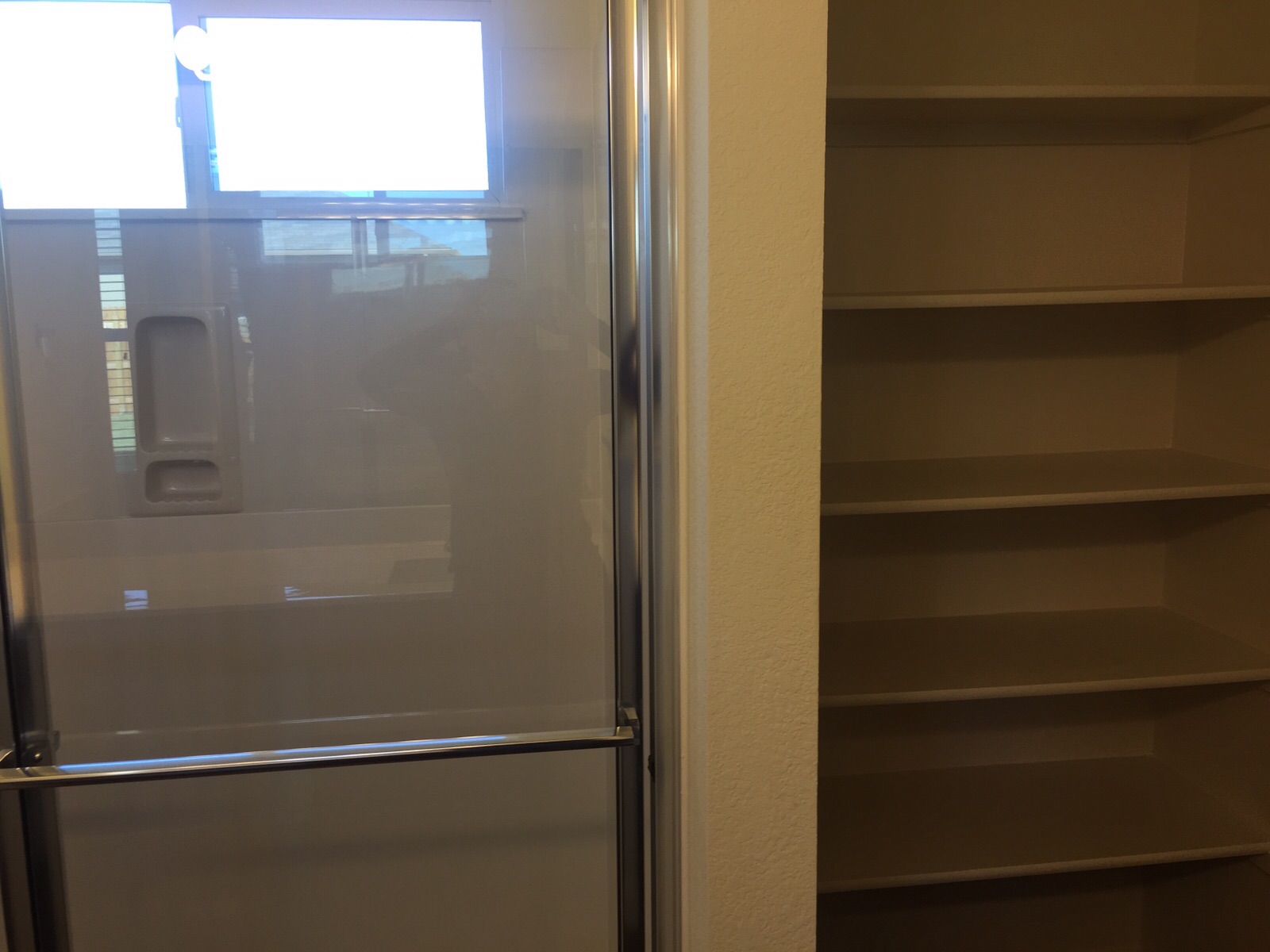 384 Discovery Kyle, TX 78640 - Photo 10 of 18 Bathroom featuring a shower stall and a closet