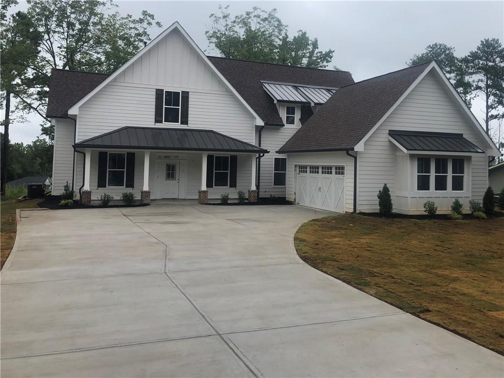 3530 Pleasant Grove Road Cumming, GA 30028 - Photo 1 of 1 a front view of a house with a yard