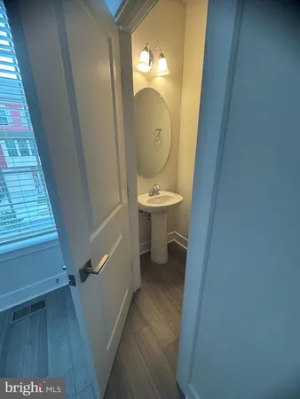 a bathroom with a bathtub a sink a toilet and a mirror