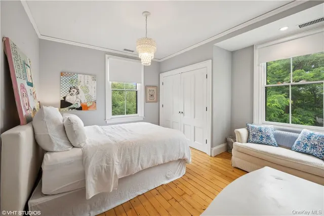 a bedroom with a bed and a couch