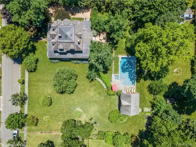an aerial view of a house with a garden
