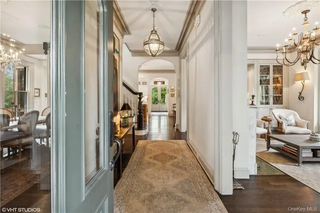 a view of a hallway view with living room and furniture