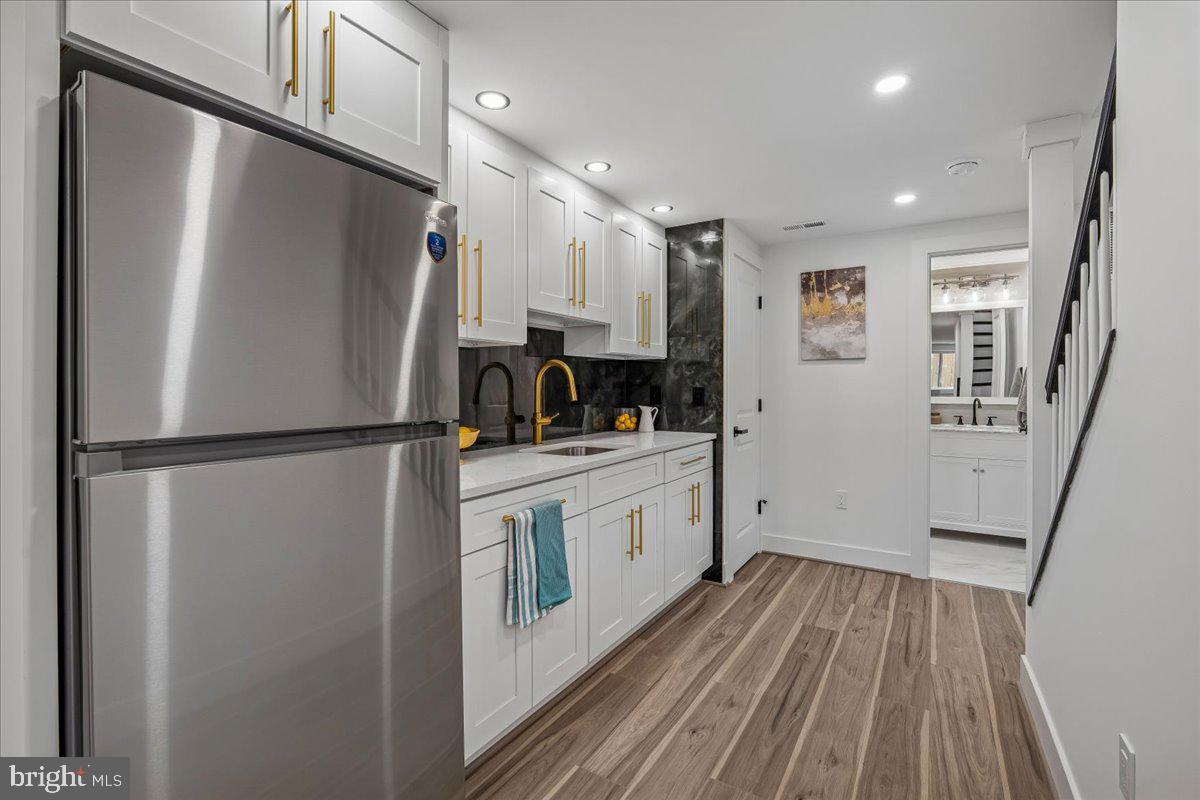 4000 Adams Drive Silver Spring, MD 20902 - Photo 17 of 21 a kitchen with a refrigerator a sink and dishwasher