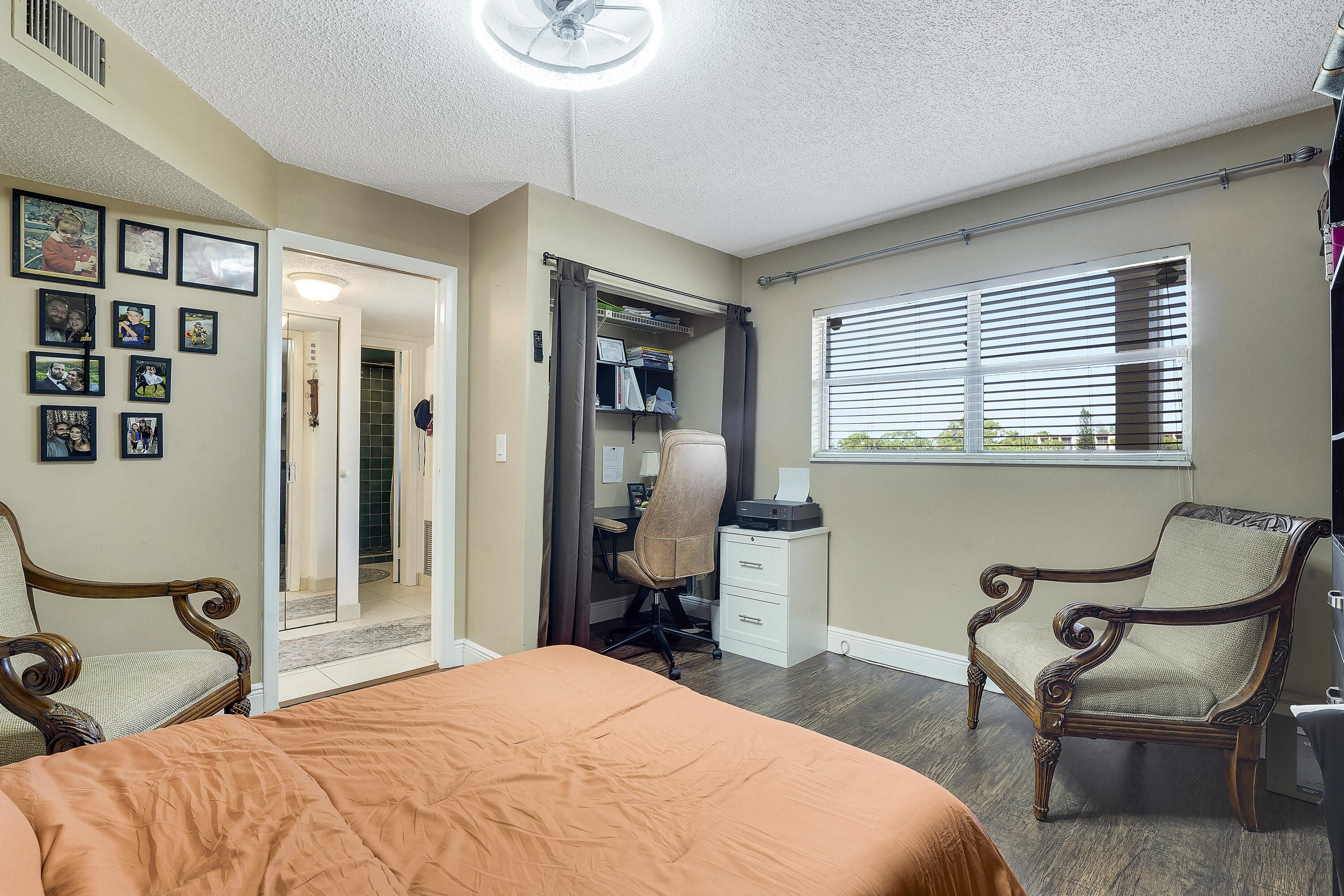 3755 Via Poinciana Lake Worth, FL 33467 - Photo 15 of 20 a bedroom with a bed and chair