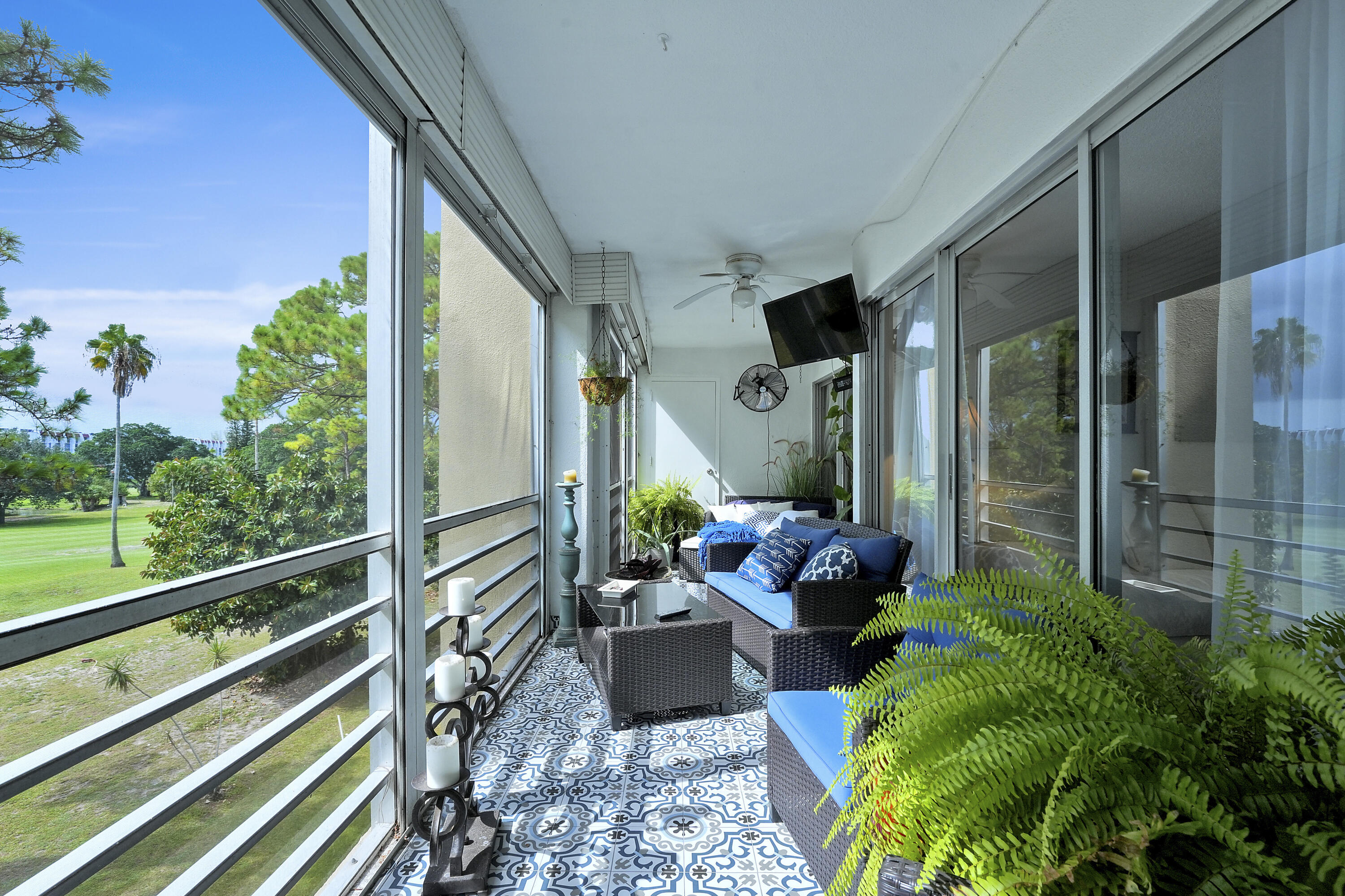 3755 Via Poinciana Lake Worth, FL 33467 - Photo 17 of 20 a living room filled with furniture and a potted plant