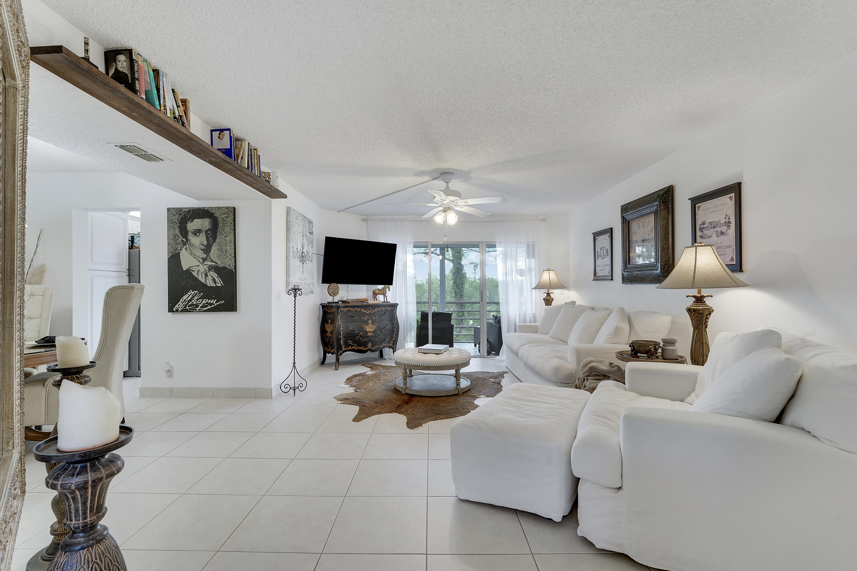 3755 Via Poinciana Lake Worth, FL 33467 - Photo 2 of 20 a living room with furniture and a flat screen tv