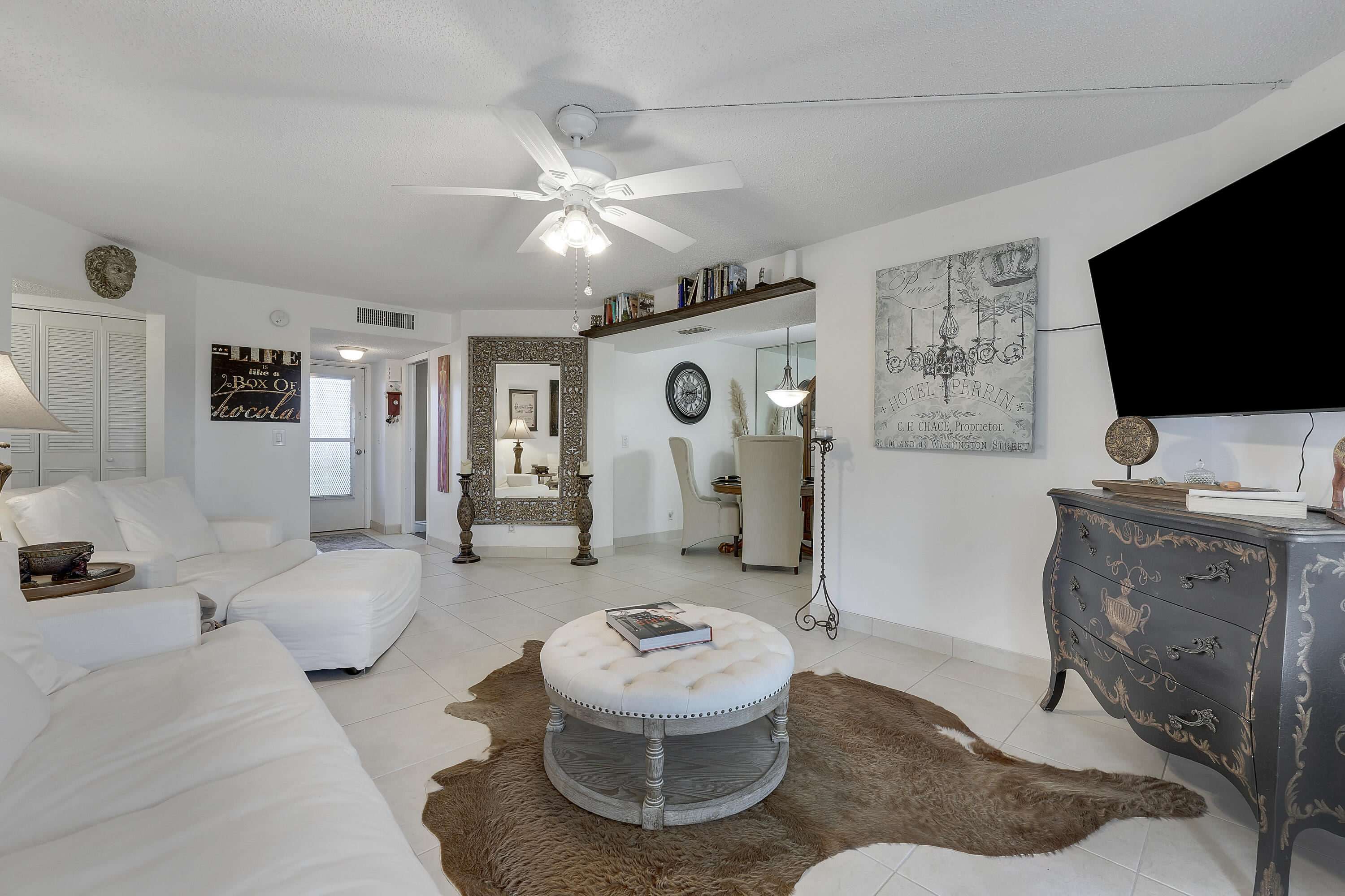 3755 Via Poinciana Lake Worth, FL 33467 - Photo 3 of 20 a living room with furniture and a flat screen tv