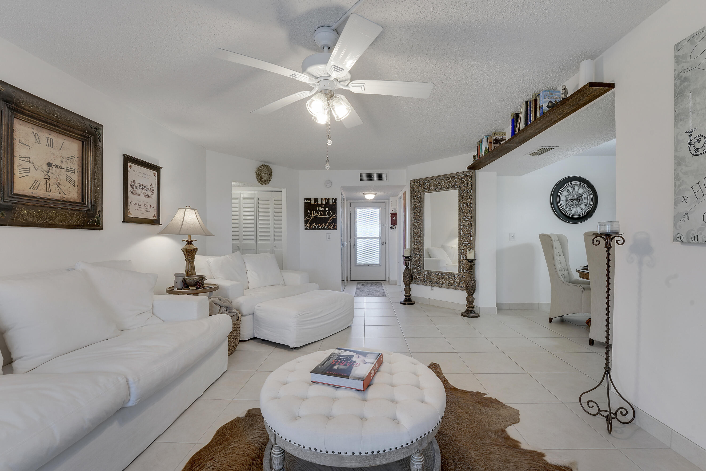 3755 Via Poinciana Lake Worth, FL 33467 - Photo 5 of 20 a living room with furniture and a clock
