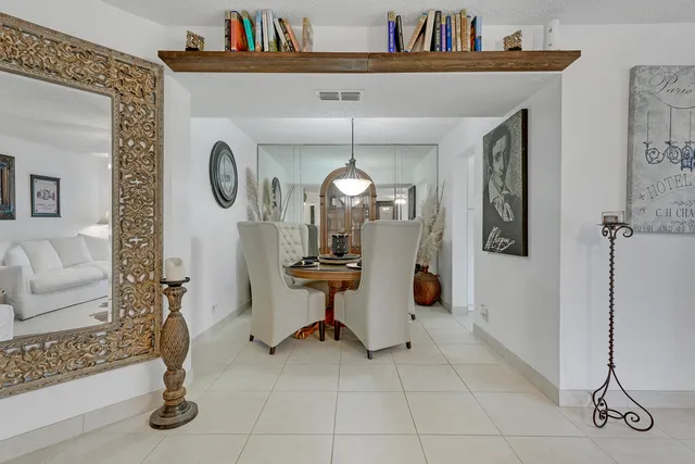 a view of a livingroom with furniture and a chandelier