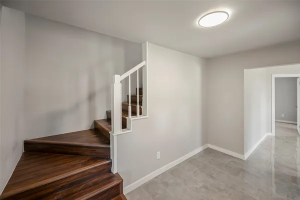 a view of a park with large trees