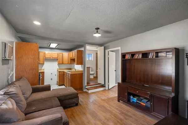 a bedroom with bed and a window
