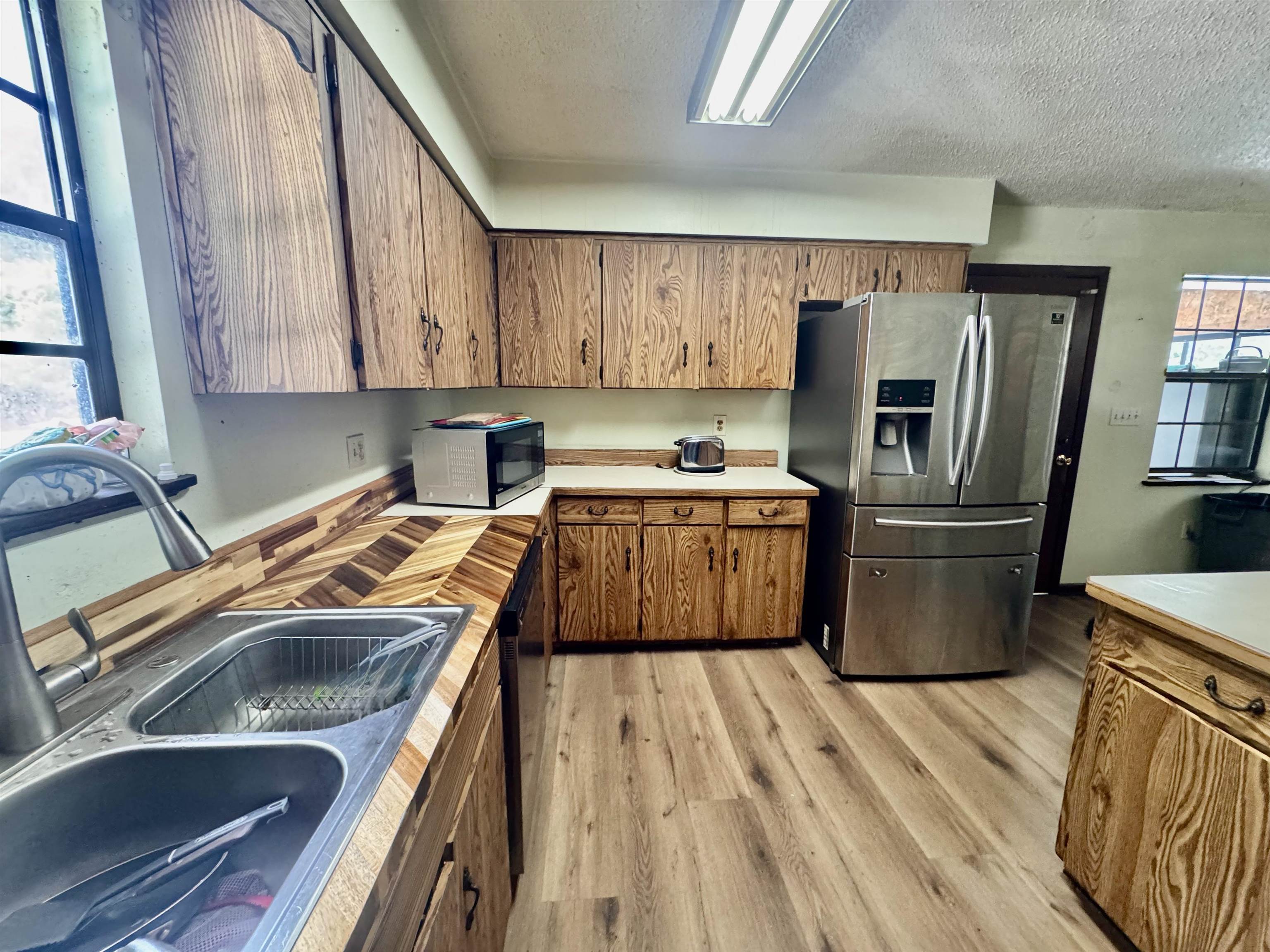 554 Hayley Road St. Augustine, FL 32086 - Photo 18 of 46 a kitchen with a sink a refrigerator and cabinets