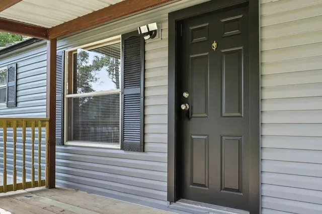 a view of a door and a window