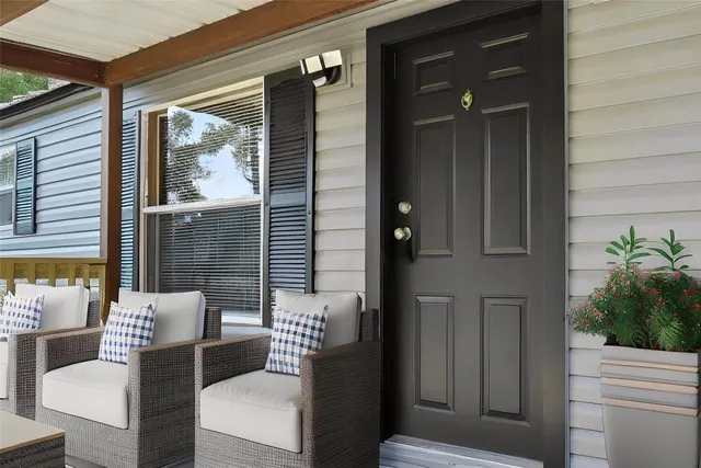 a view of a balcony and chairs