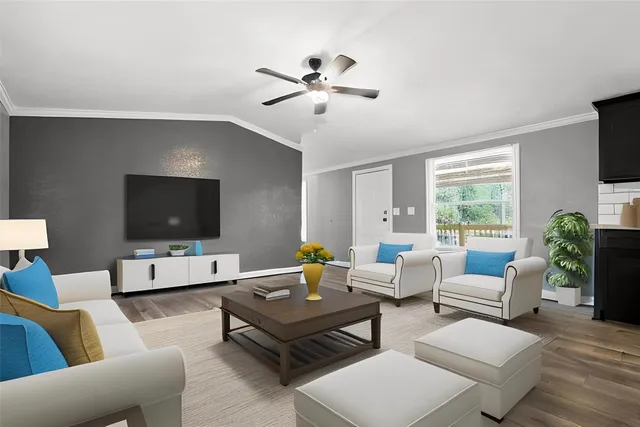 a living room with furniture and a flat screen tv