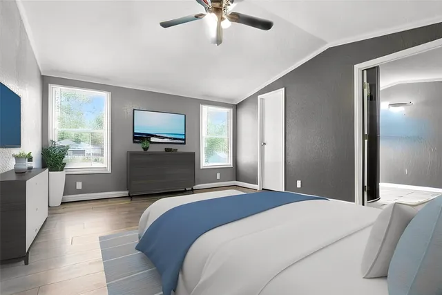 a bedroom with a bed and window