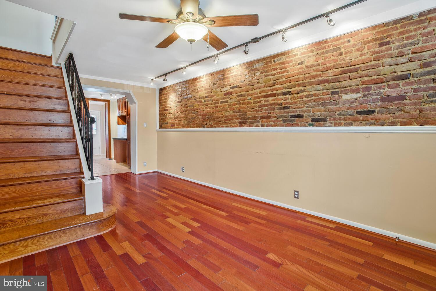 1148 Roland Heights Avenue Baltimore, MD 21211 - Photo 11 of 38 Exposed brick with track lighting